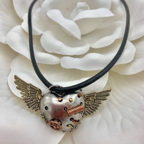 Silver and copper pendant on black leather